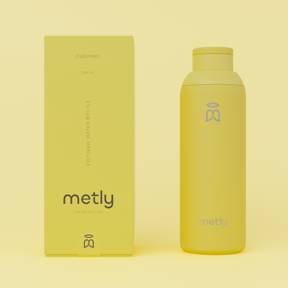 Metly Custard 500ml filtered water bottle displayed next to its matching yellow packaging, featuring the OG Edition branding and specifying a 500ml capacity.