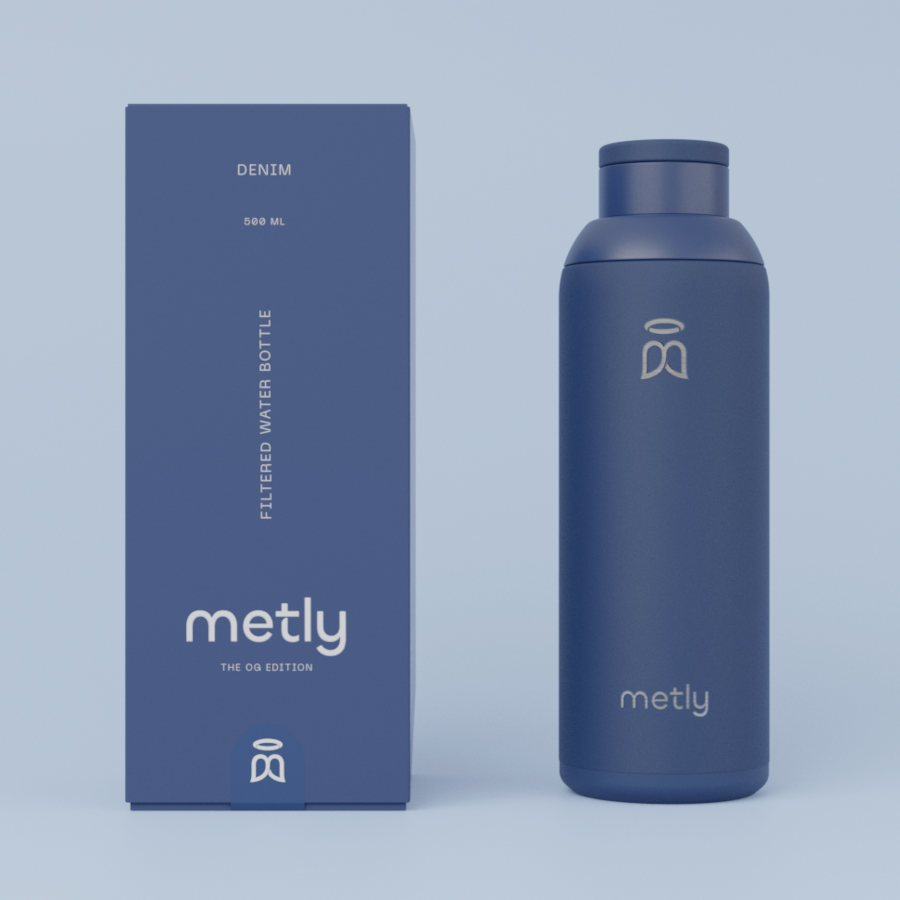 Metly Denim 500ml filtered water bottle displayed next to its matching deep blue packaging, featuring the OG Edition branding and specifying a 500ml capacity